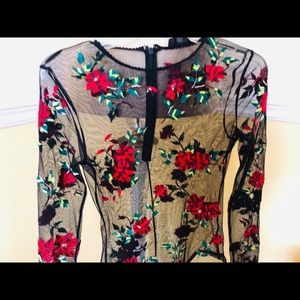 Black soft lace and embroidered body suit. Size 6.